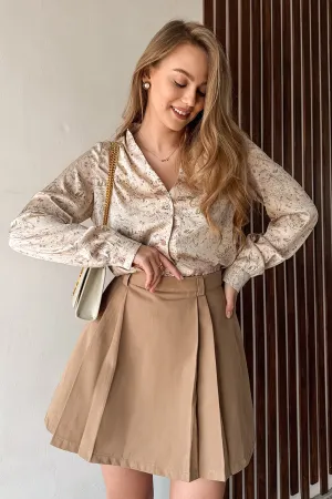 Beige A-line skirt with elegant pleats at the front