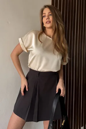 Graphite A-line skirt with elegant pleats at the front